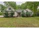 Charming single-story home with a well-maintained front yard and classic architectural details at 3585 Goodman Lake Rd, Salisbury, NC 28146