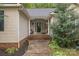 Inviting front porch with seating, offering a welcoming entrance to this charming home at 3585 Goodman Lake Rd, Salisbury, NC 28146