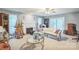 Cozy living room with fireplace, ceiling fan, and ample natural light at 3585 Goodman Lake Rd, Salisbury, NC 28146