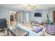 Comfortable living space with a large TV, bright walls, and a view into the next room at 3585 Goodman Lake Rd, Salisbury, NC 28146