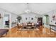 Bright living room with vaulted ceiling, hardwood floors, chandelier, and decorative furnishings at 3585 Goodman Lake Rd, Salisbury, NC 28146
