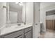 Bathroom featuring a vanity with gray cabinets, a white countertop, and a framed mirror at 3588 County Down Ave, Kannapolis, NC 28081