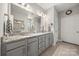 Bright bathroom with double vanity, granite counters, and tiled floor and shower at 3588 County Down Ave, Kannapolis, NC 28081