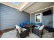 Relaxing covered patio with outdoor seating, perfect for entertaining or enjoying the outdoors at 3588 County Down Ave, Kannapolis, NC 28081