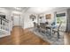 Open-concept dining room with modern decor and hardwood flooring at 3588 County Down Ave, Kannapolis, NC 28081