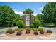 Stone community entrance sign surrounded by landscaping, creating a welcoming view at 3588 County Down Ave, Kannapolis, NC 28081