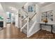Open entryway featuring hardwood floors, stairs to the second floor, and view into dining room at 3588 County Down Ave, Kannapolis, NC 28081