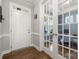 Bright entryway with hardwood floors, transom window, and French doors leading to office at 3588 County Down Ave, Kannapolis, NC 28081