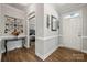 Elegant foyer featuring hardwood floors, wainscoting, and stylish decor setting a welcoming tone at 3588 County Down Ave, Kannapolis, NC 28081