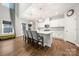 Bright kitchen features a large island with quartz countertops, stainless appliances, and pendant lighting at 3588 County Down Ave, Kannapolis, NC 28081