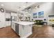 Open kitchen and living area with stainless steel appliances and hardwood floors at 3588 County Down Ave, Kannapolis, NC 28081
