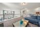 Comfortable living room with plush blue sectional sofa, carpet, and a glass-topped coffee table at 3588 County Down Ave, Kannapolis, NC 28081