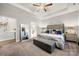 Serene main bedroom with tray ceiling, plush carpet, and view into ensuite bathroom at 3588 County Down Ave, Kannapolis, NC 28081