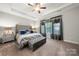 Spacious main bedroom with tray ceiling, neutral colors, and ample natural light at 3588 County Down Ave, Kannapolis, NC 28081