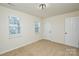 Bedroom showing a standard window for natural light and a white door to exit at 3602 Brookstone Trl, Indian Trail, NC 28079