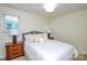Cozy bedroom showcasing a comfortable bed with plush pillows, complemented by two nightstands at 3602 Brookstone Trl, Indian Trail, NC 28079