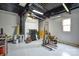 Large garage space with a window, equipped with epoxy flooring, ample room for various storage and workshop setups at 3602 Brookstone Trl, Indian Trail, NC 28079