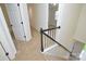 Hallway with carpet, white doors, and railing leading downstairs to the first floor at 3602 Brookstone Trl, Indian Trail, NC 28079
