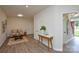 Cozy living area with hardwood floors and modern decor offers a comfortable space with natural lighting at 3602 Brookstone Trl, Indian Trail, NC 28079