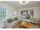 Bright and airy living room with a large window, modern artwork, and stylish furnishings at 3602 Brookstone Trl, Indian Trail, NC 28079
