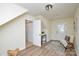 Bright room featuring a chair, table, and an access door on hardwood flooring at 3602 Brookstone Trl, Indian Trail, NC 28079