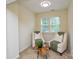 Cozy sitting room showcasing two chairs, a unique table, and a window at 3602 Brookstone Trl, Indian Trail, NC 28079