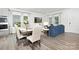 Open concept dining area with table, chairs, and view to the living room and kitchen at 363 Cedar Knoll Cir, Pineville, NC 28134