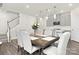 Bright dining room showcases a wooden table, six chairs, and modern pendant lighting at 363 Cedar Knoll Cir, Pineville, NC 28134