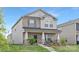 Charming two-story home with a brick facade, landscaped front yard, and covered porch at 363 Cedar Knoll Cir, Pineville, NC 28134