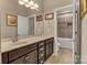 Elegant bathroom with a vanity and a mirror, accompanied by a separated tub and shower, ensuring a relaxing experience at 4071 Thames Cir, Fort Mill, SC 29715