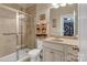 Cozy bathroom featuring a glass enclosed shower, neutral tile, and vanity with good storage at 4071 Thames Cir, Fort Mill, SC 29715