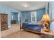 Large bedroom with a four-poster bed, a dresser, and windows, designed for a peaceful retreat at 4071 Thames Cir, Fort Mill, SC 29715
