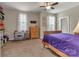 Relaxing bedroom with dual windows providing natural light, paired with a desk and a bed, for a comfortable stay at 4071 Thames Cir, Fort Mill, SC 29715