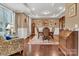 Elegant dining room with hardwood floors, tray ceiling, wainscotting, and classic furnishings at 4071 Thames Cir, Fort Mill, SC 29715