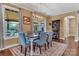 Elegant dining room features a modern chandelier and backyard views from the windows at 4071 Thames Cir, Fort Mill, SC 29715
