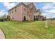 Spacious brick house with well-maintained lawn and landscaping, situated on a sunny lot at 4071 Thames Cir, Fort Mill, SC 29715