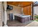 Relax in this hot tub featuring a mounted television and wood-lined walls for added privacy at 4071 Thames Cir, Fort Mill, SC 29715