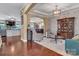 Open-concept living area with hardwood flooring, neutral walls, and an arched doorway at 4071 Thames Cir, Fort Mill, SC 29715