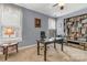 Inviting home office with a large desk, bookshelves, and natural light from the window at 4071 Thames Cir, Fort Mill, SC 29715