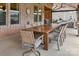 A long, wooden outdoor dining table provides ample seating for entertaining on the patio at 4071 Thames Cir, Fort Mill, SC 29715