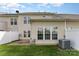 A spacious backyard with a well-maintained lawn and a white privacy fence provides a tranquil outdoor area at 4208 Carl Parmer Dr, Harrisburg, NC 28075