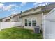 A spacious backyard with a well-maintained lawn and a white privacy fence provides a tranquil outdoor area at 4208 Carl Parmer Dr, Harrisburg, NC 28075
