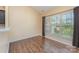 Bright bedroom with wood floors, neutral walls, and large windows at 4208 Carl Parmer Dr, Harrisburg, NC 28075