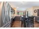 Modern kitchen featuring stainless steel appliances, hardwood floors, and warm lighting at 4208 Carl Parmer Dr, Harrisburg, NC 28075