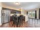 Modern kitchen featuring stainless steel appliances, an eat-in kitchen, and hardwood floors at 4208 Carl Parmer Dr, Harrisburg, NC 28075