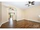Open concept living area with hardwood floors and neutral walls, offering a flexible living space at 4208 Carl Parmer Dr, Harrisburg, NC 28075