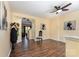 Bright living room featuring hardwood floors and a ceiling fan at 4208 Carl Parmer Dr, Harrisburg, NC 28075