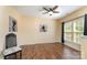 Spacious living room with hardwood floors, a ceiling fan, and natural light at 4208 Carl Parmer Dr, Harrisburg, NC 28075