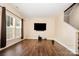 A bright living room with wood floors, neutral walls, and lots of natural light at 4208 Carl Parmer Dr, Harrisburg, NC 28075
