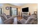 Comfortable living room features hardwood floors and lots of seating at 4208 Carl Parmer Dr, Harrisburg, NC 28075